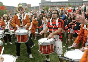 Stan Morton ’04 cranks it out with the University Band on Poe-Pardee Field at the end of the P-rade.