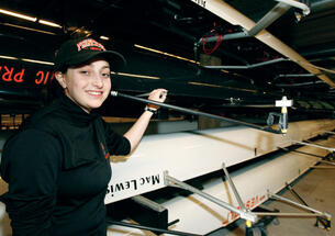 Erin Rosenbaum ’11, a coxswain for the men’s lightweights, wears reminders of two of her rowing forebears, grandfather Pete ’48 and great-grandfather Francis ’20, on her rowing cap.