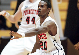 High-scoring guard Douglas Davis ’12, center, has improved as a defender.