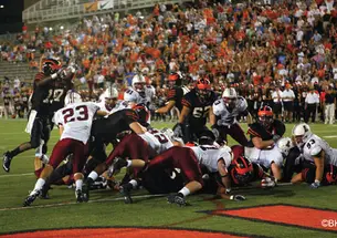 Jordan Culbreath '11, in foreground, reaches across for the winning touchdown against Lafayette Sept. 25.
