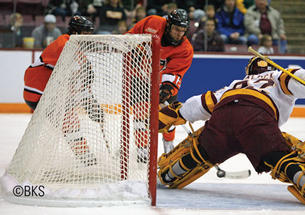 Kevin Lohry ’11 shoots against UMD.