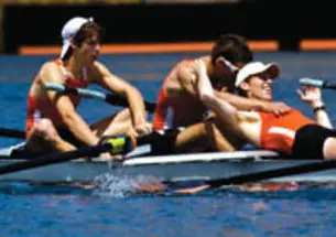 From left, Christian Klein ’11, James Donovan ’10, and Tom Paulett ’09 celebrate a national title.