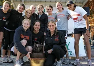 The women’s cross country team celebrates its 2009 Ivy Championship, the fourth for its seniors, in front row, from left, Reilly Kiernan, Alexa Glencer, and Liz Costello.