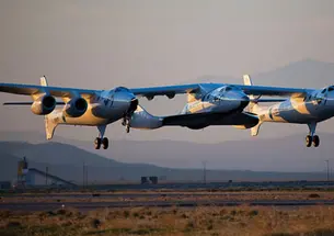 LIVE.Space_LedeAdjusted.jpg The WhiteKnight Two, known as the mother ship Eve, resembles a flying catamaran. Between the two “pontoons” is SpaceShip Two, christened the VSS Enterprise.