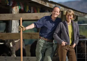 Rob and Kate Williams, both Class of 1989, at Steadfast Farm, home of the Vermont Yak Company. They co-own the company with two other couples.