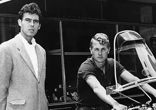 John Hopkins ’60 sits on a motorcycle to the right, while friend Joe McPhillips ’58 stands on the left in this black-and-white photo. The pair’s motorcycle journey through North Africa in the 1960s was the subject of Hopkins’ The White Nile Diaries. This image appeared on the cover of the book.