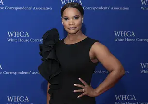 Laura Coates ’01 is photographed against a backdrop that reads "White House Correspondents’ Association."