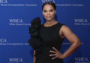 Laura Coates ’01 is photographed against a backdrop that reads "White House Correspondents’ Association."