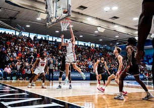 Caden Pierce ’26 lays in a basket against Brown