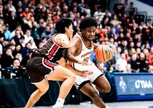 Dalen Davis ’27 drives to the basket against Brown. 