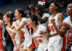 Princeton’s bench cheers for the Tigers during the second half of the women’s semifinal win over Penn.