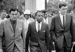 John Doar ’44, right, escorts James Meredith at the University of Mississippi in 1962.