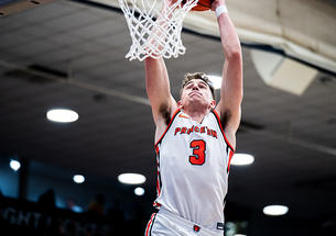 Caden Pierce ’26 rises for a dunk against Brown