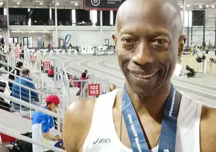 Bruce McBarnette in front of an indoor track