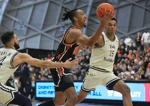 Tosan Evbuomwan ’23 plays with the Princeton men against Yale during Ivy Madness.