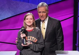 Terry O’Shea ’16, pictured with Alex Trebek, is a lifelong Jeopardy! fan. 