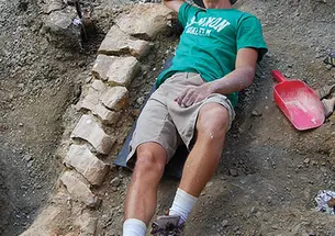 Evan Saitta ’14 at the site of a fossil dig in Montana.