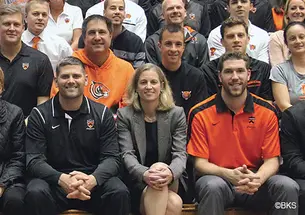 Mollie Marcoux ’91, front row center, poses with coaches and athletics department staffers.