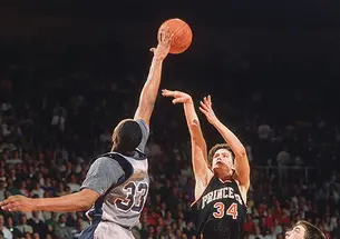 Alonzo Mourning blocks a shot by Bob Scrabis ’89 in the 1989 NCAA Tournament. The Tigers’ Kit Mueller ’91 would get one more chance, but Mourning blocked that attempt as well.