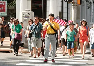 Frank Wojciechowski - A University-bound tour group crosses Nassau Street.