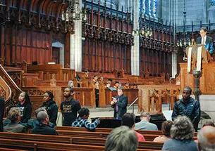 Students turn their backs to President Eisgruber ’83 as he speaks in the Chapel April 12.