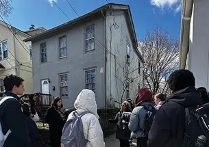 Fern Spruill, center, leads students on a walking tour