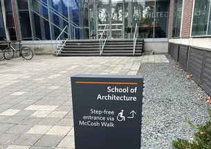 OTC_CLass Closeup_Diability Justice_2681 copy.jpg Entrance to the School of Architecture with accessibility signage