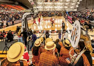 This is a photo of Princeton playing Harvard in men's basketball, with the marching band's backs to the camera.