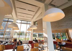 An airy Fu Hall common space faces the courtyard between the colleges.