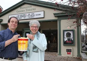Mark Bernstein ’83, Dean Jill Dolan, and a bucket of popcorn outside the Princeton Garden Theatre.
