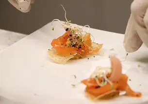This is a close-up photo of cured salmon atop “invisible” chips.