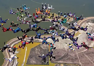 George White ’57 is at 12 o’clock of the inner ring of eight, in black, in this 2012 world-record jump.