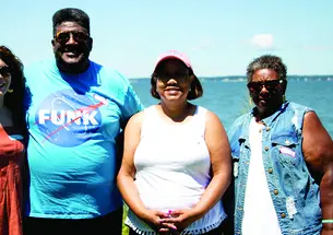 Allison Thomas ’78, Rufus Frazier, Maria Montgomery, and Shirley Frazier pose for photo.