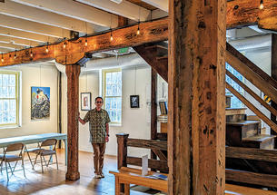 Angelo Otterbein ’95 inside Manor Mill, left, and what it looked like before the renovations were underway, above.