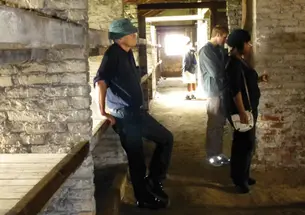 Poland0670.jpg Students visit Birkenau, part of the Nazis’ Auschwitz concentration camp. From left, professor Jan Gross, Eric Silberman ’13, and Lydia Demissachew ’15 examine the barracks where Jewish prisoners were housed.