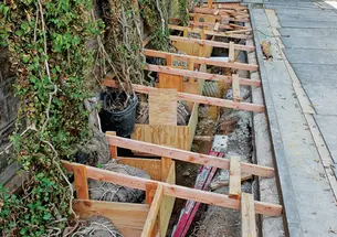 Preserving West College’s ivy while waterproofing its basement.
