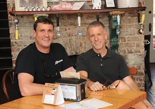 Tim Koons-McGee ’80, left, and his husband, Roy, resolved to embark on a career together: running an ice cream shop.