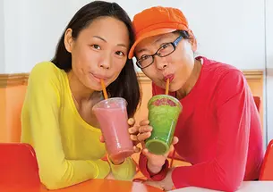 Yuchen Zhang ’10, left, and her mother, Tanyue Chen, run a smoothie shop in downtown Santa Monica.