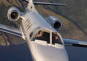 Howard Tobin ’60 at the controls of his Citation Jet, which he uses to transport wounded veterans.