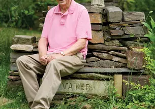 Professor emeritus John Fleming *63 in his garden, with a statue of one of his research subjects: St. Francis of Assisi. During Reunions, Fleming was honored by the Association of Princeton Graduate Alumni. 