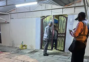 Marwan Khraisat, a researcher at Saudi Arabia’s King Saud University, speaks to a woman during canvassing in Kuwait City. The woman ultimately turned him down for the survey. 