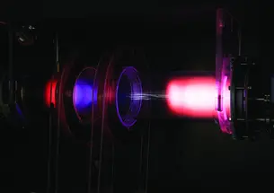 Pink glowing plasma inside PPPL’s Science Education Lab