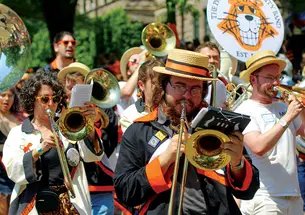 The brass, from left: Christina Farah ’09, Justin Coon ’22, and Riley Fitzgerald ’16