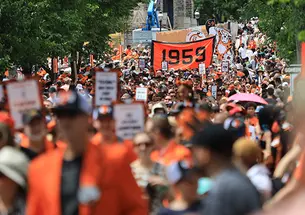 A dense crowd ahead of the Class of 1958 sign at the P-rade.