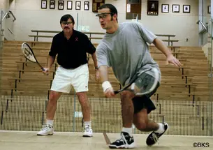 Men’s squash coach Bob Callahan ’77 retired in April after 32 seasons at Princeton. In 2005, Callahan, left, scrimmaged with top player Yasser El Halaby ’06.