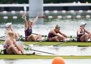 Sitting in a crew boat, Hannah Scott ’21, arms raised, celebrates Great Britain’s narrow victory in the quadruple sculls. 