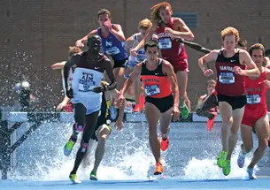 Donn Cabral ’12, center, won the 3,000-meter steeplechase at the NCAA Championships to become the first Princeton runner to win an NCAA title since 1934.