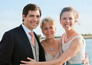 Swimming coach Susan Teeter, center, officiated at the May wedding of Alyson Goodner ’00 and Paul Daniels.