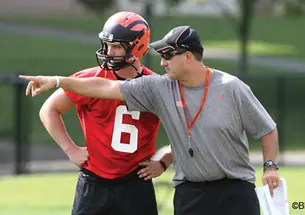Kedric Bostic ’16, left, is one of three quarterbacks that football coach Bob Surace ’90, right, says have star potential. 