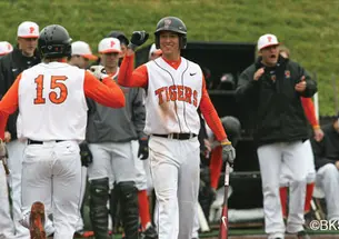 Much of the Tigers’ success this season comes from its versatile roster. Players such as Matt Bowman ’13 (at center facing camera, greeting Jonathan York ’14) play more than one position.